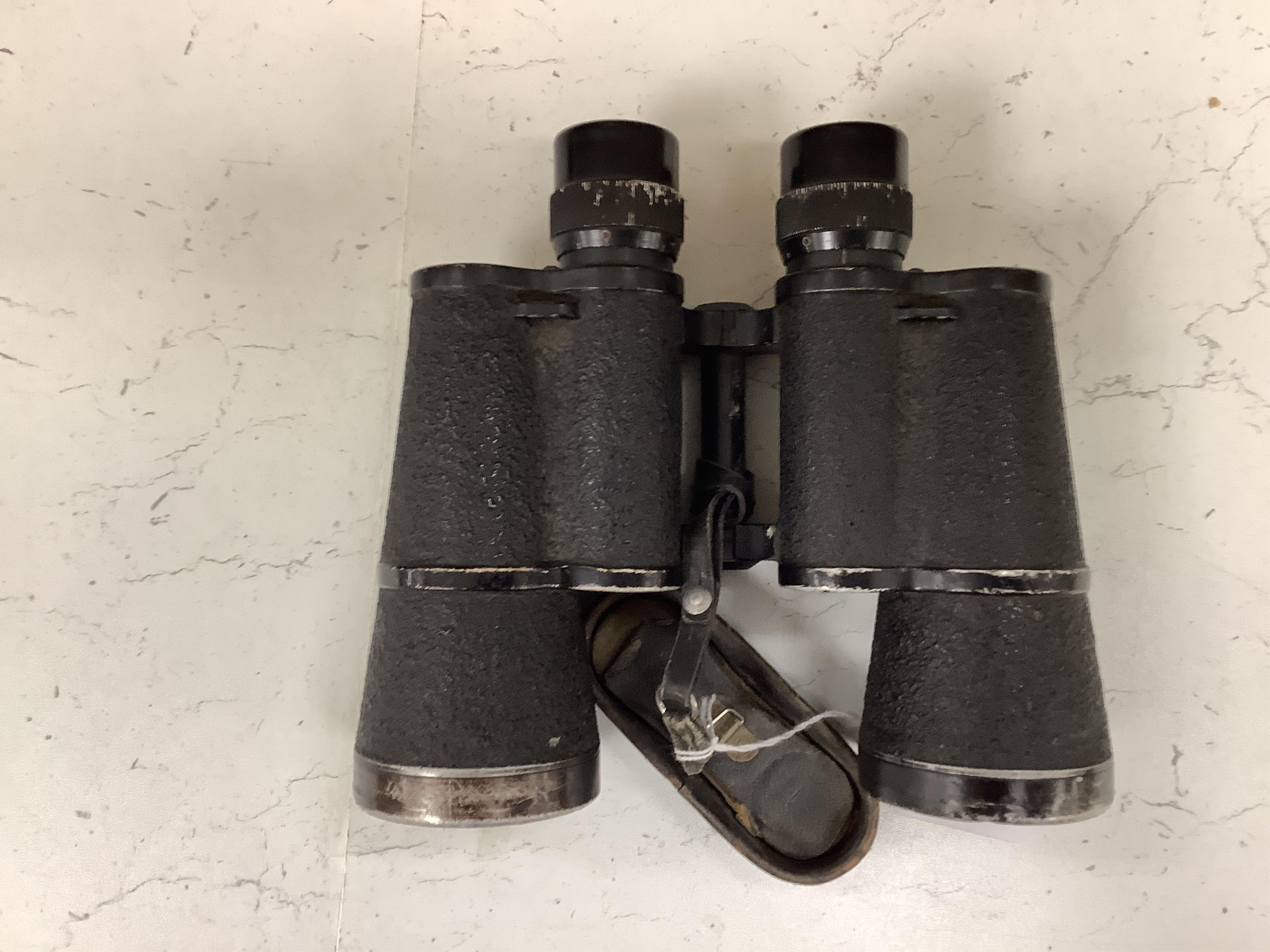 A pair of World War II German military binoculars, 17.5cm long. Condition - worn